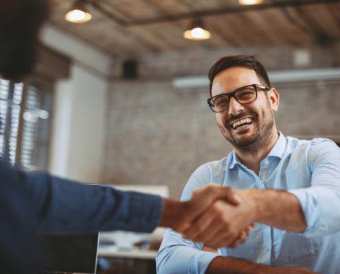 Close up of handshake in the office