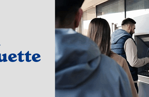 People standing in line at a bank ATM
