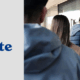 People standing in line at a bank ATM