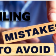 Man holding tiles with the words "mistakes to avoid"