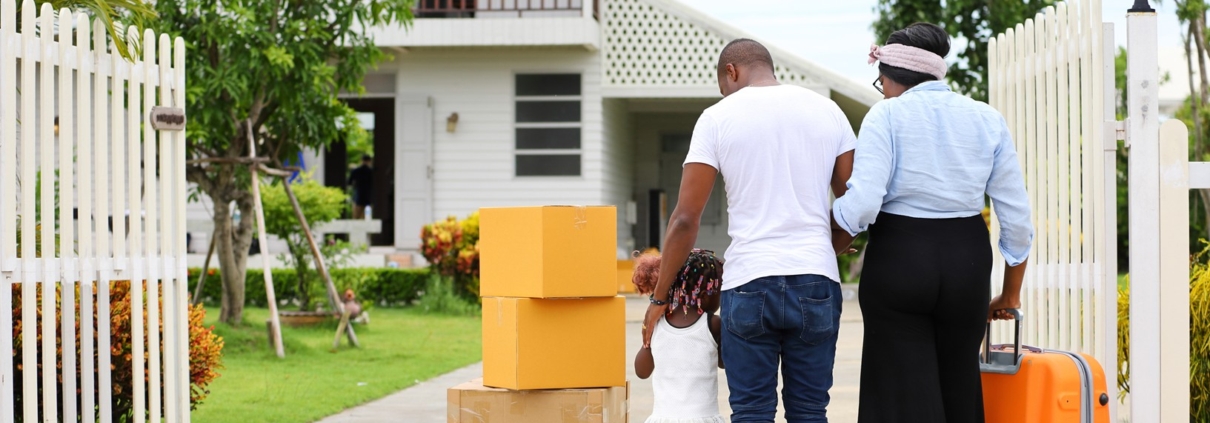 African American family moving into a new home after getting approved for a mortgage loan with Bank of St. Croix.