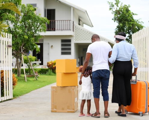 African American family moving into a new home after getting approved for a mortgage loan with Bank of St. Croix.
