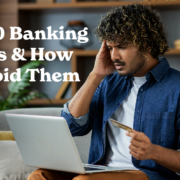 A person sits on a couch using a laptop while holding a bank card. Large text on the left reads, “Top 10 Banking Scams & How to Avoid Them.” Bookshelves and houseplants are visible in the background. The image illustrates online banking security and fraud awareness.